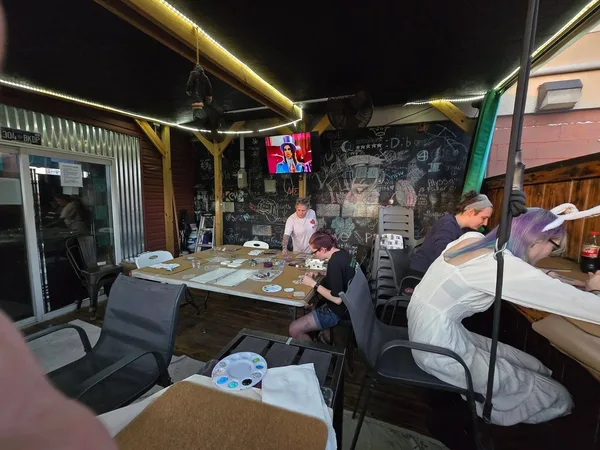 Painting together on the covered patio