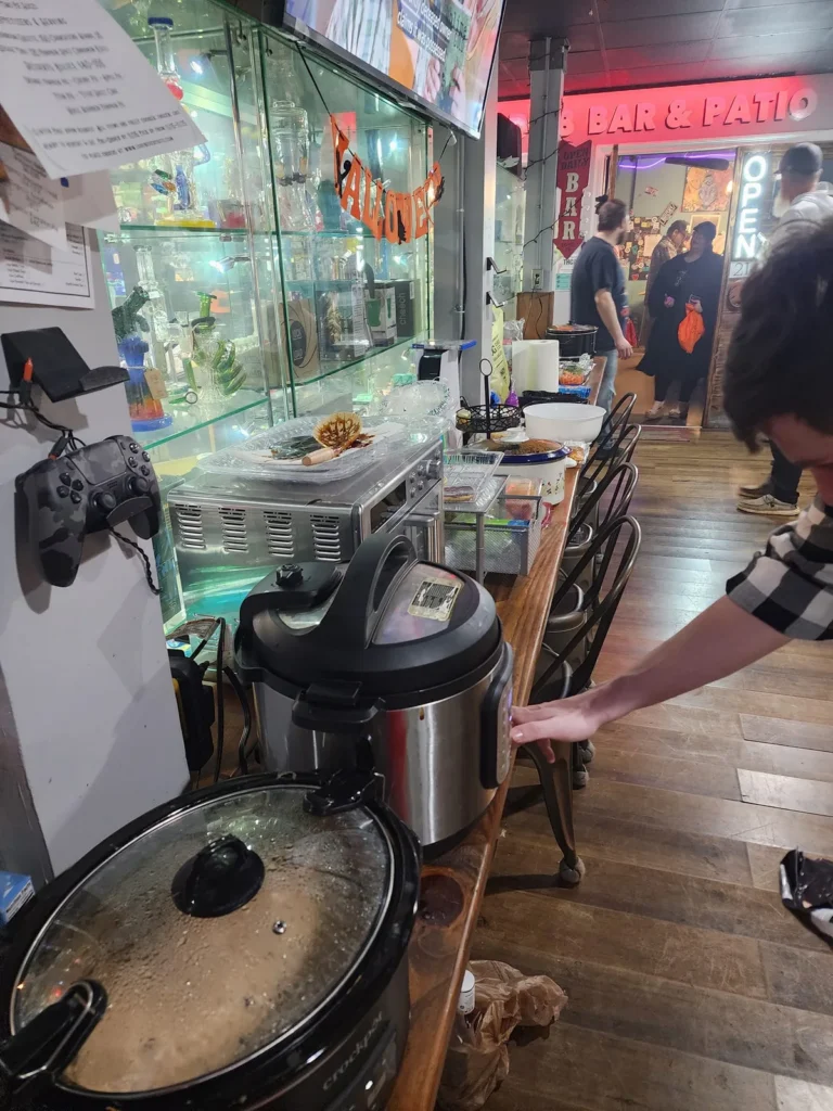 Store interior with a person near the counter during the Halloween event.