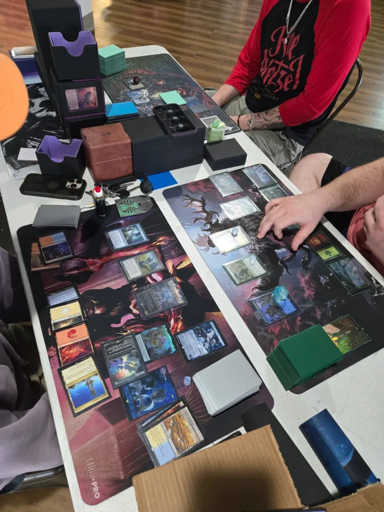 Magic: The Gathering game in progress at the store.