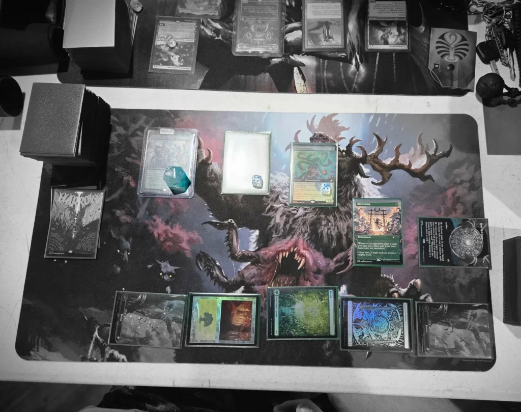 Magic: The Gathering cards arranged on a play mat.