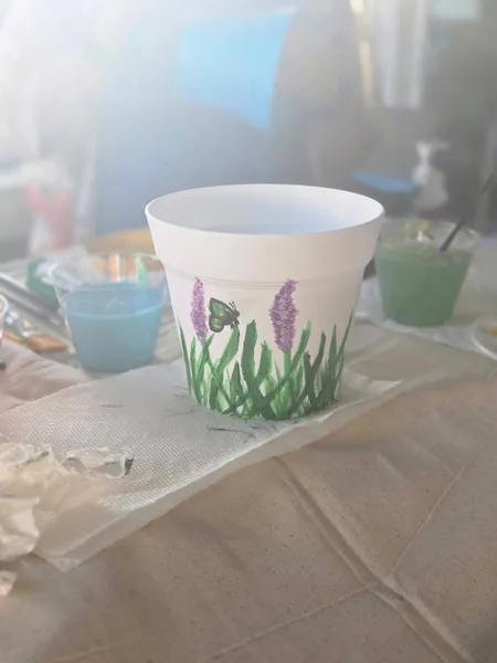 A hand-painted lavender flower pot